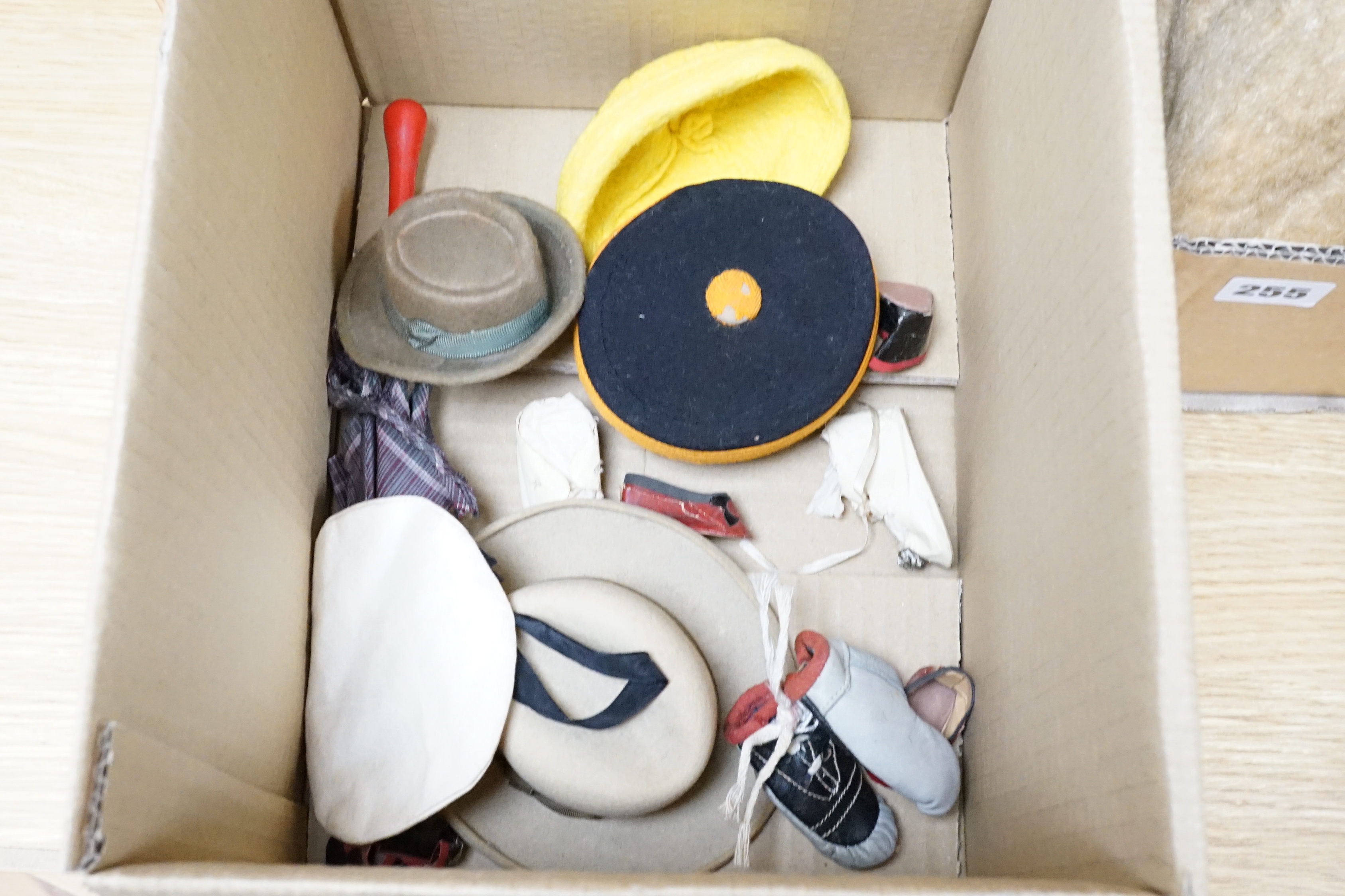 A collection of eleven bear size vintage hats, straw and felt, and a pair of miniature boxing gloves, also white books and Victorian brown leather boots, three pairs of dolls shoes and an umbrella